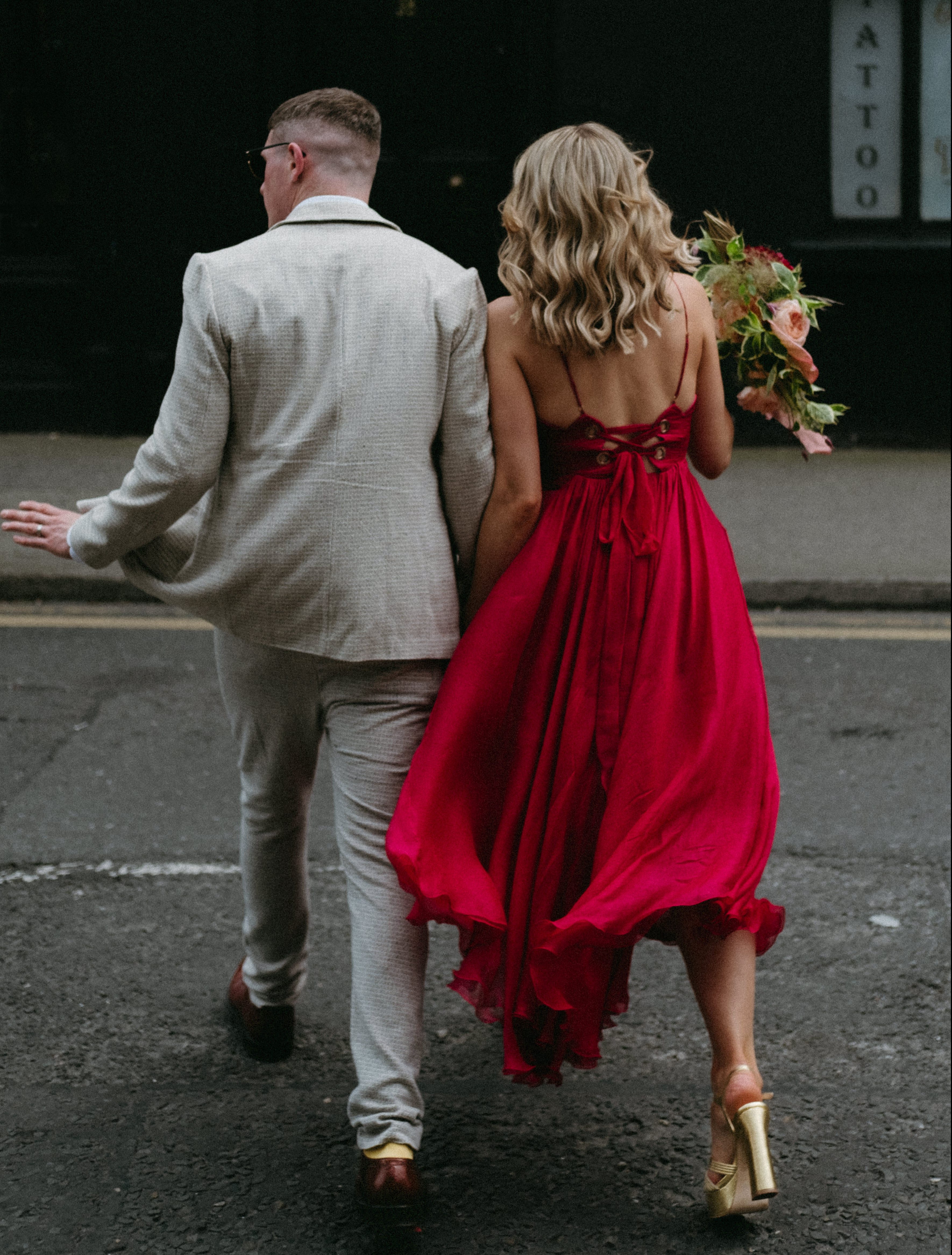 couple cross busy dublin street on wedding day humanist wedding dublin